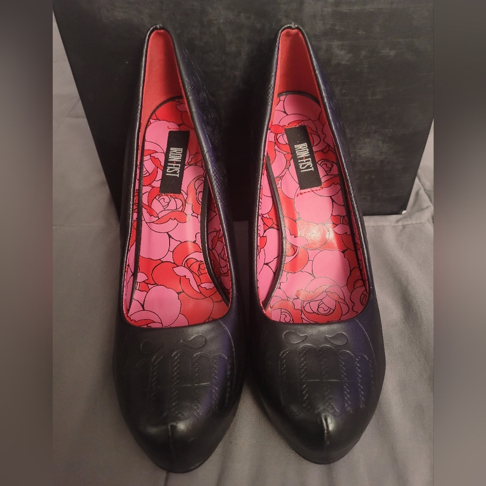 Iron fist black heels with skull imprints